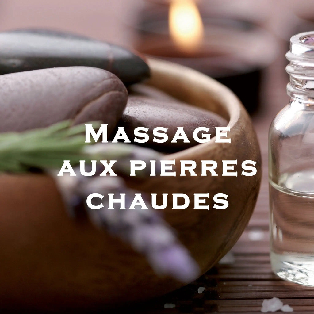 Bol en bois rempli de pierres de rivière lisses gris foncé et violet pour massage aux pierres chaudes