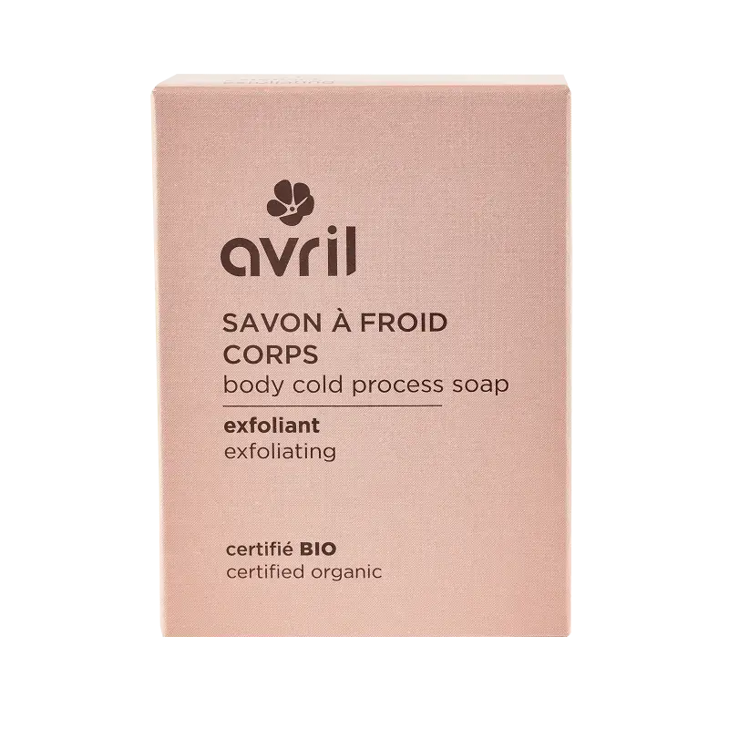 Un savon à froid exfoliant avril dans une boîte rectangulaire rose pâle avec un design minimaliste